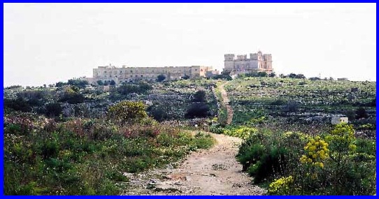 Selmun Palace with its namesake hotel to the left. This view was taken near the path to the Mgiebah Valley.